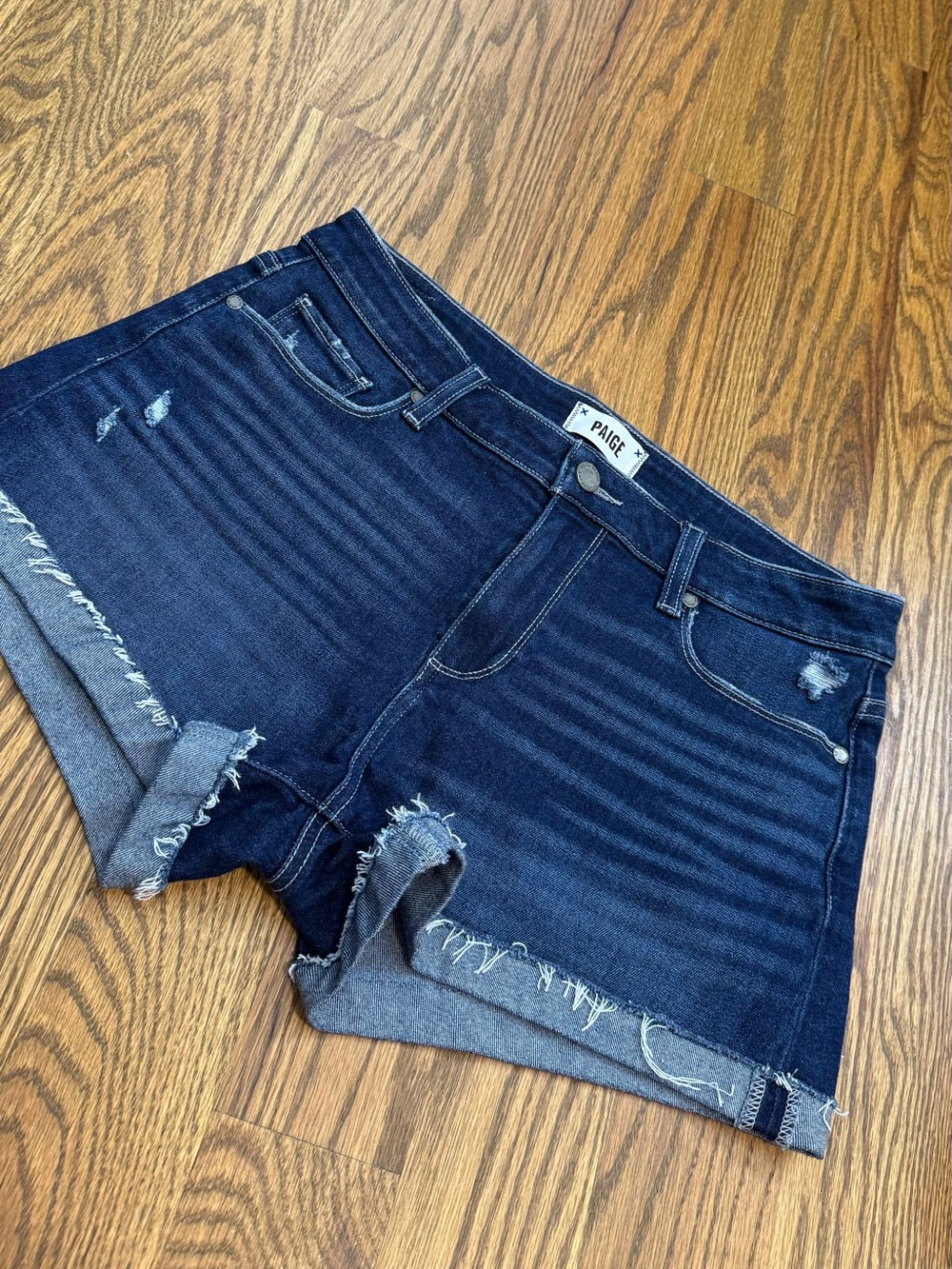 PAIGE Dark Indigo Distressed Denim Shorts